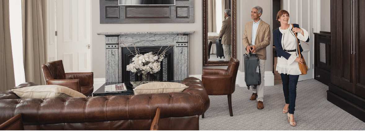Couple walking into hotel room