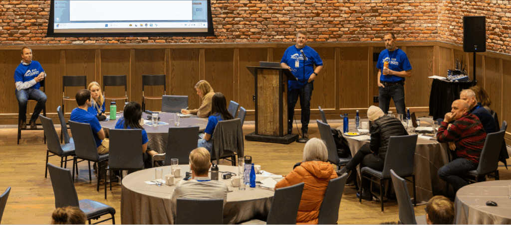 Attendees participate in an open forum session during the 2025 rezStream Customer Success Conference, sharing feedback and feature requests with the rezStream team.